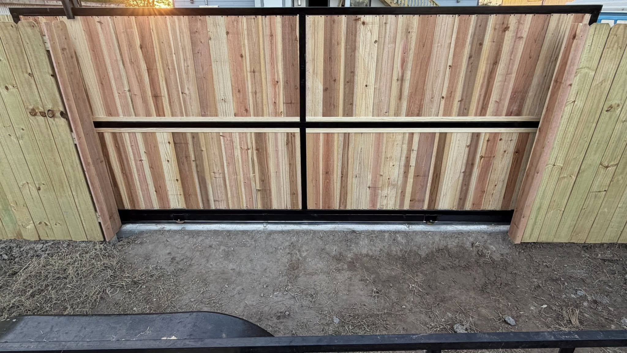 Close-up of custom wood-filled steel gate