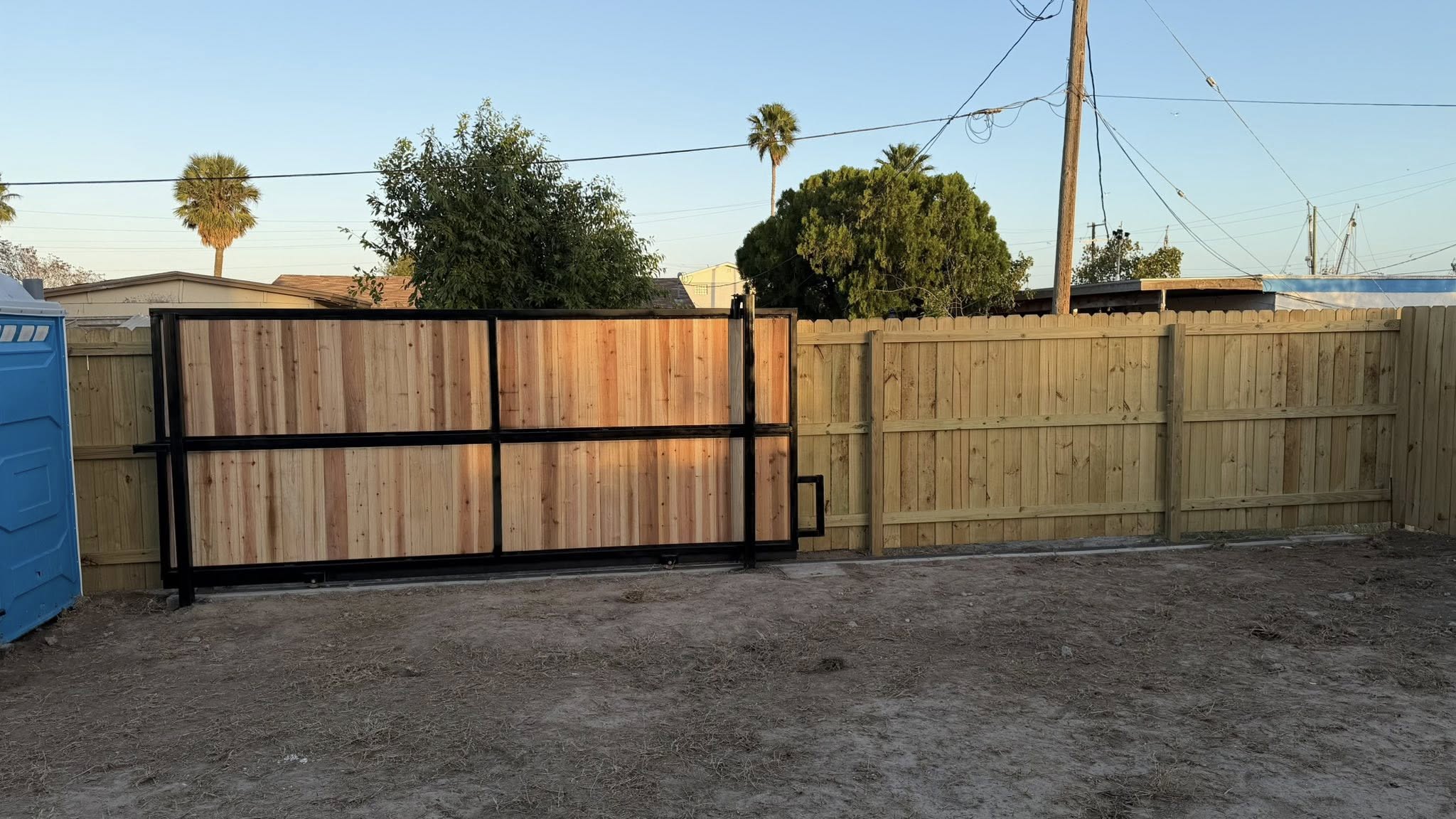 Custom wood and steel sliding gate installation